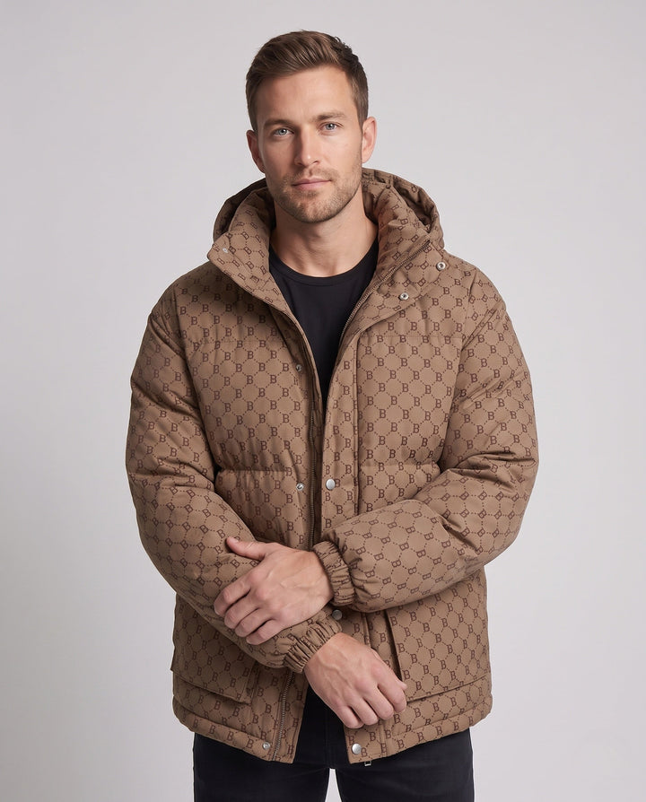 Men's quilted oversized parka with hood, allover monogram, snap button placket, and large patch pockets