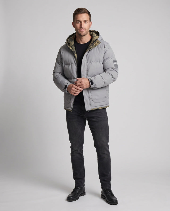 Men's short thermal quilted parka with hood, applied flap pockets, concealed front placket, and camouflage-lined interior