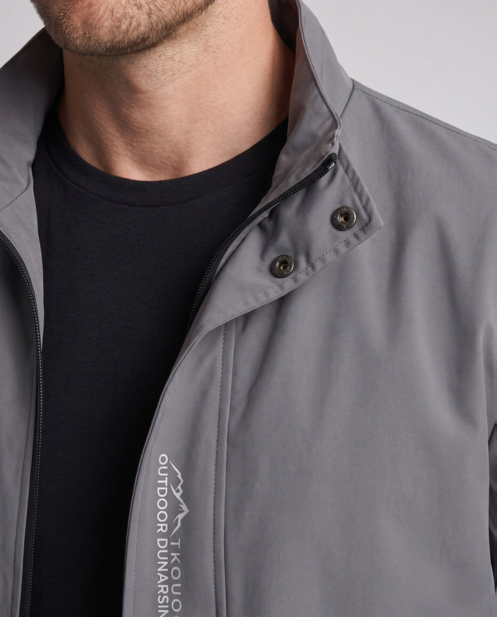 Men's lightweight microfiber windbreaker with stand-up collar, water-repellent surface, and concealed pockets