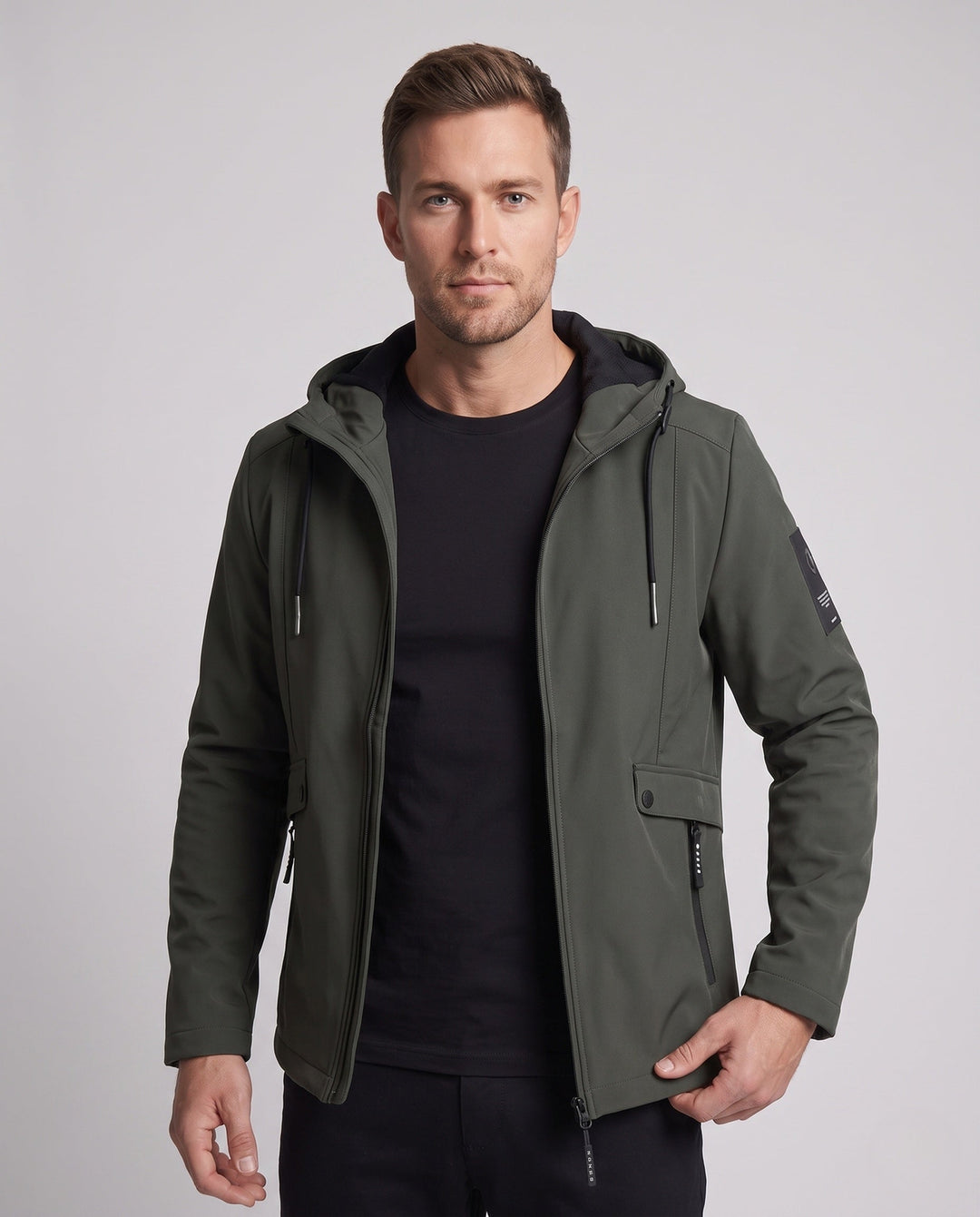 Men's lightweight softshell parka with hood, wind-resistant surface, hidden zipper, and flap pockets
