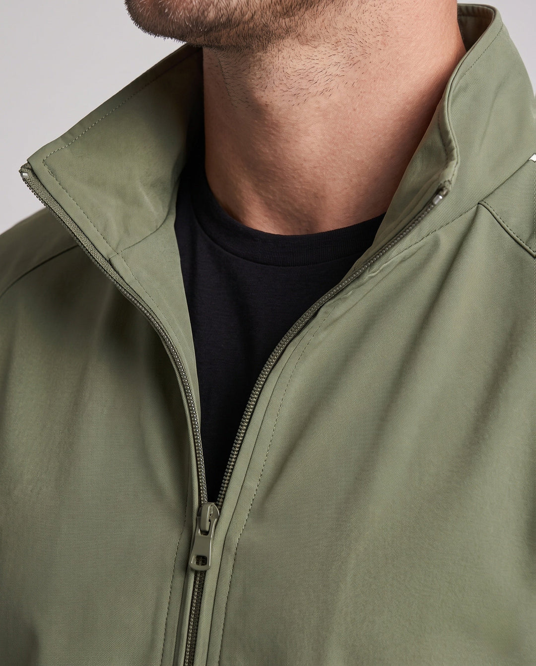 Men's lightweight sports jacket with sleeve stripes, full-length zipper, and elastic cuffs