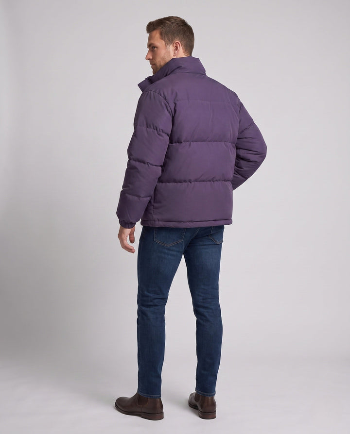 Men's minimalist thermal puffer jacket with high stand-up collar, internal wind protection, and elastic hem