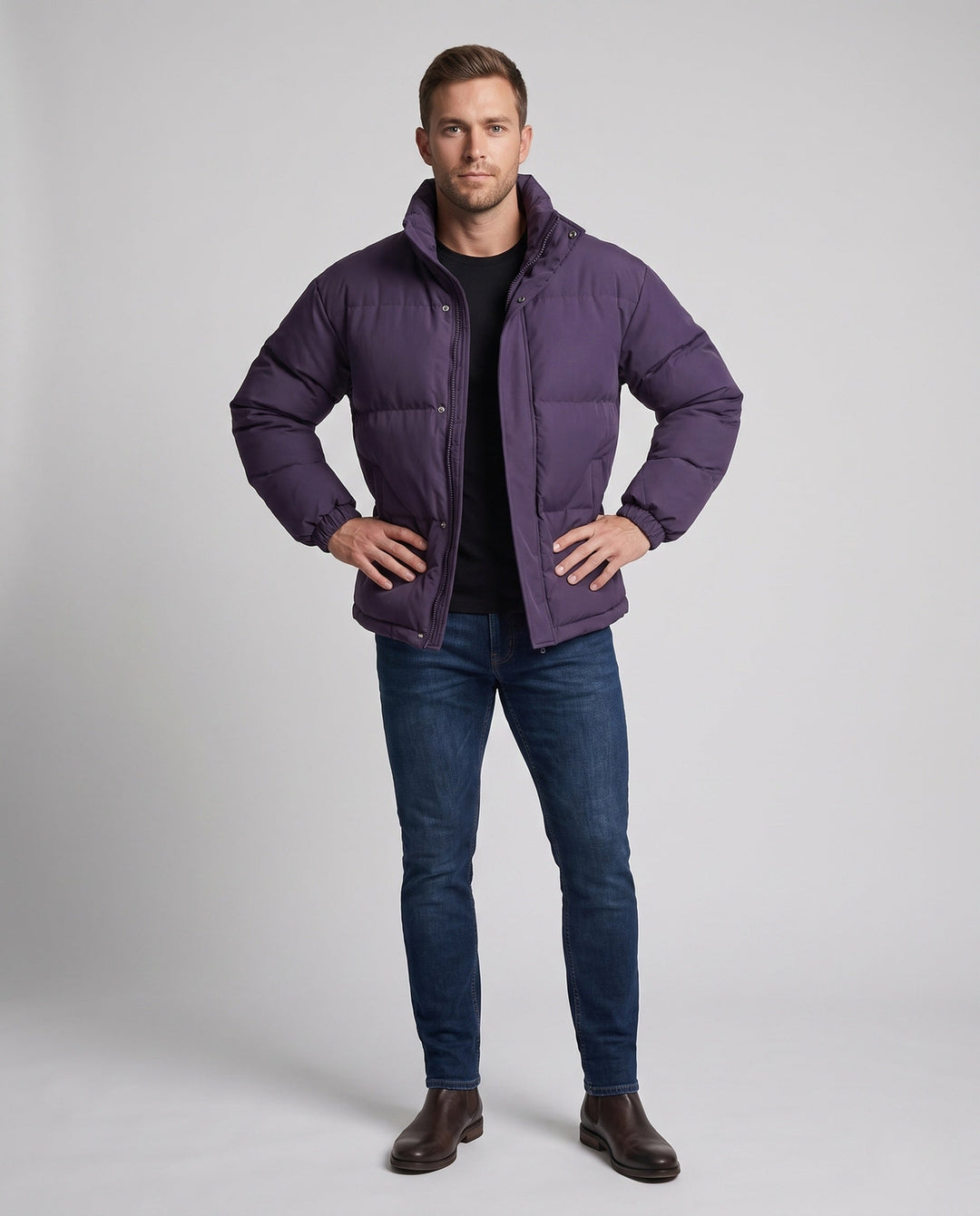 Men's minimalist thermal puffer jacket with high stand-up collar, internal wind protection, and elastic hem