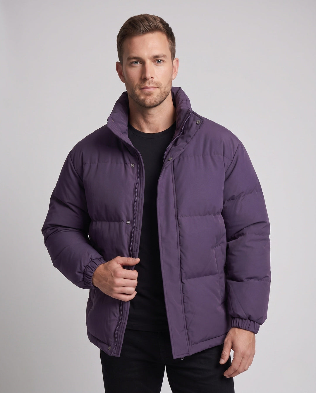 Men's minimalist thermal puffer jacket with high stand-up collar, internal wind protection, and elastic hem