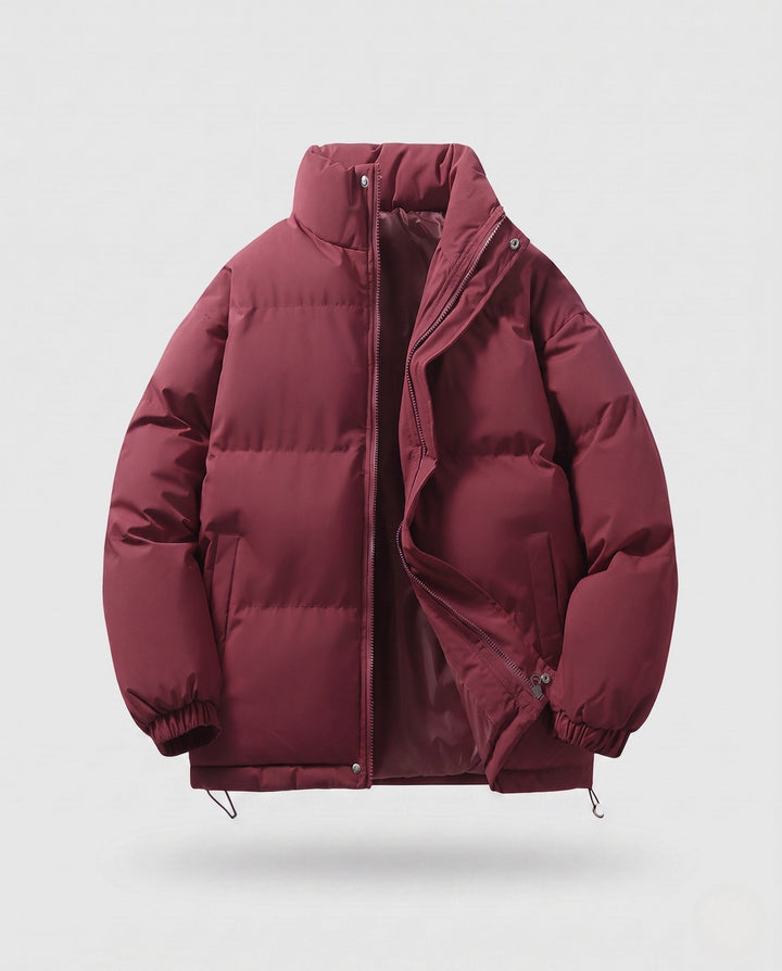 Men's minimalist thermal puffer jacket with high stand-up collar, internal wind protection, and elastic hem