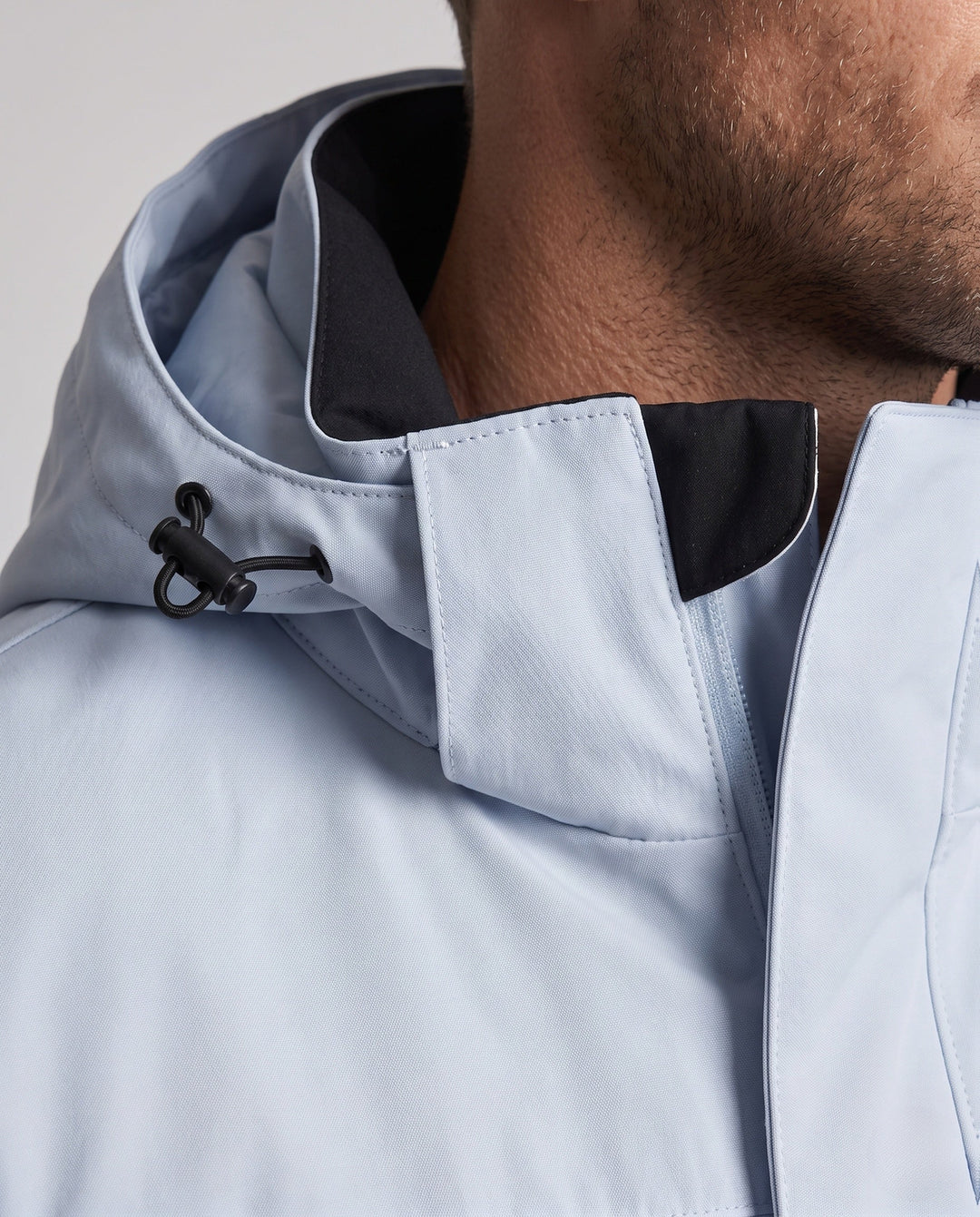 Men's technical, wind- and water-repellent hooded jacket with concealed front placket and multiple zip pockets