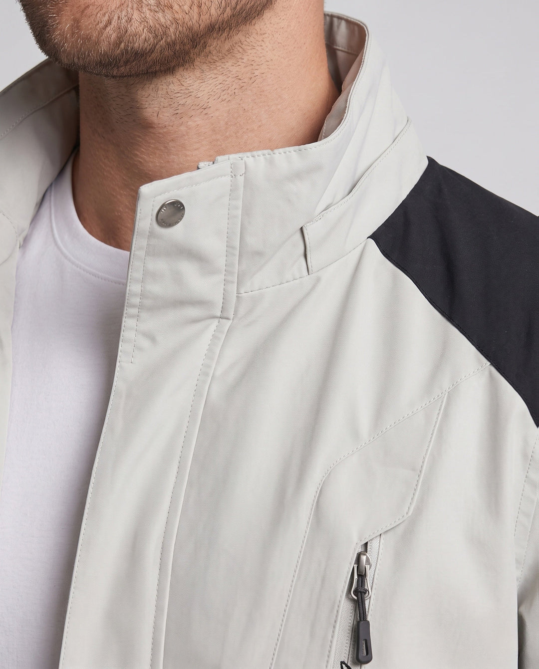 Men's ultralight packable hardshell jacket with adjustable hood, taped seams and angled chest zipper