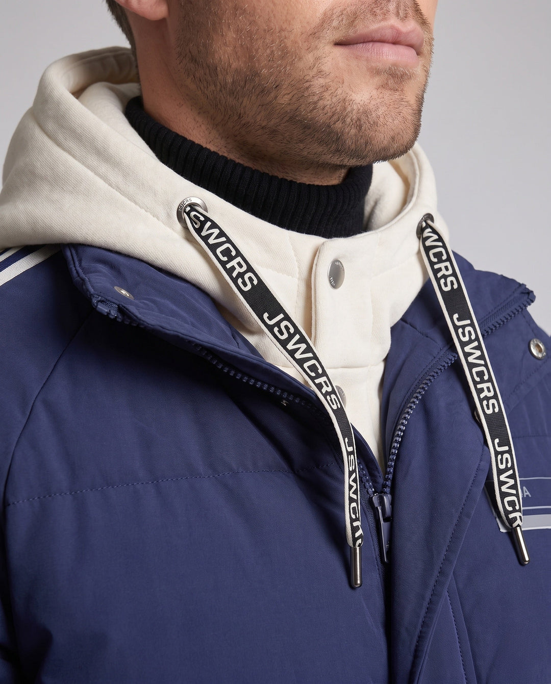 Men's urban layered hooded parka with drawstring, decorative stripes, and padded filling