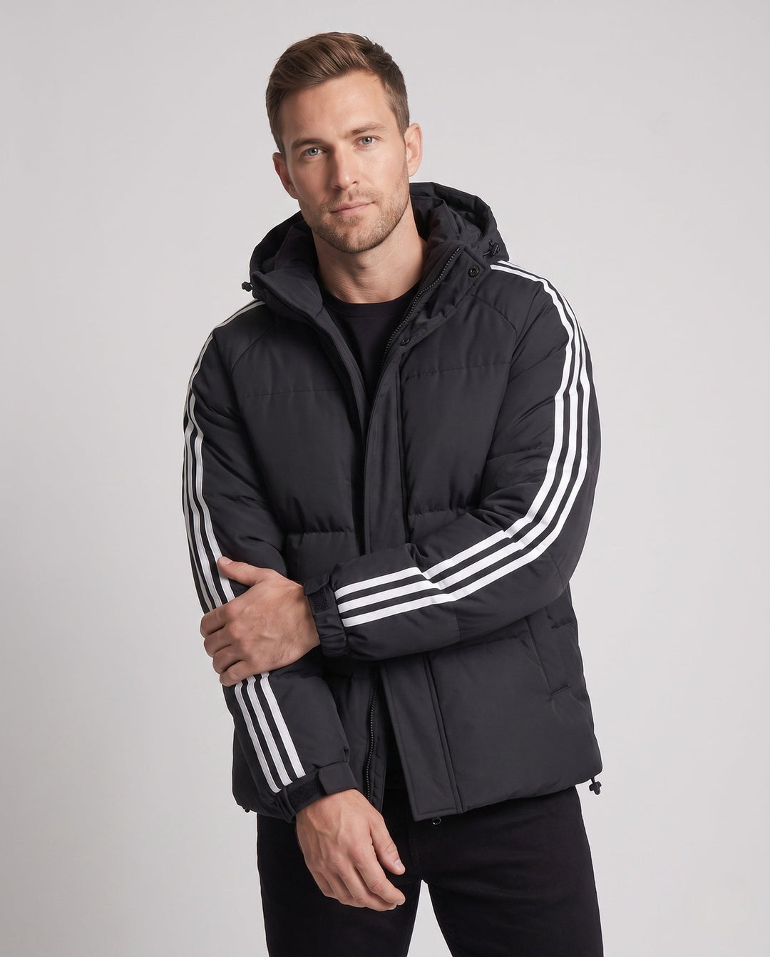 Men's padded hooded jacket in sporty streetwear look with contrasting stripe sleeves and wind-resistant outer shell