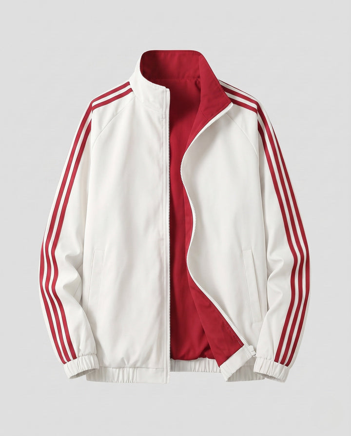 Unisex reversible sports jacket with reversible design, stand-up collar, full-length zipper, and distinctive sleeve stripes