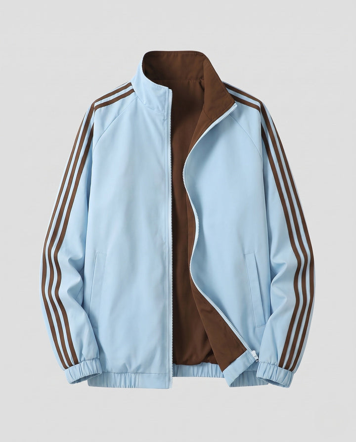 Unisex reversible sports jacket with reversible design, stand-up collar, full-length zipper, and distinctive sleeve stripes