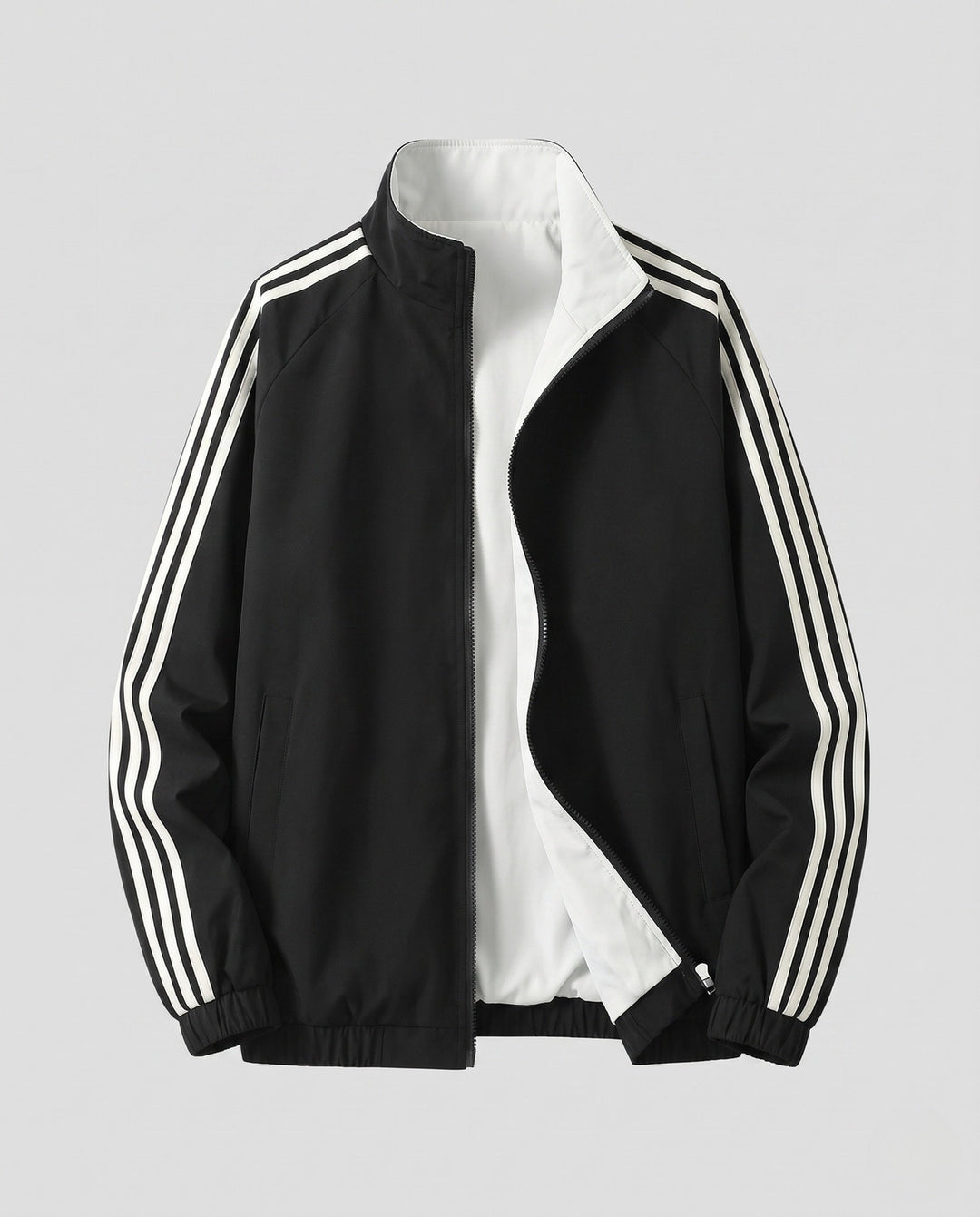 Unisex reversible sports jacket with reversible design, stand-up collar, full-length zipper, and distinctive sleeve stripes