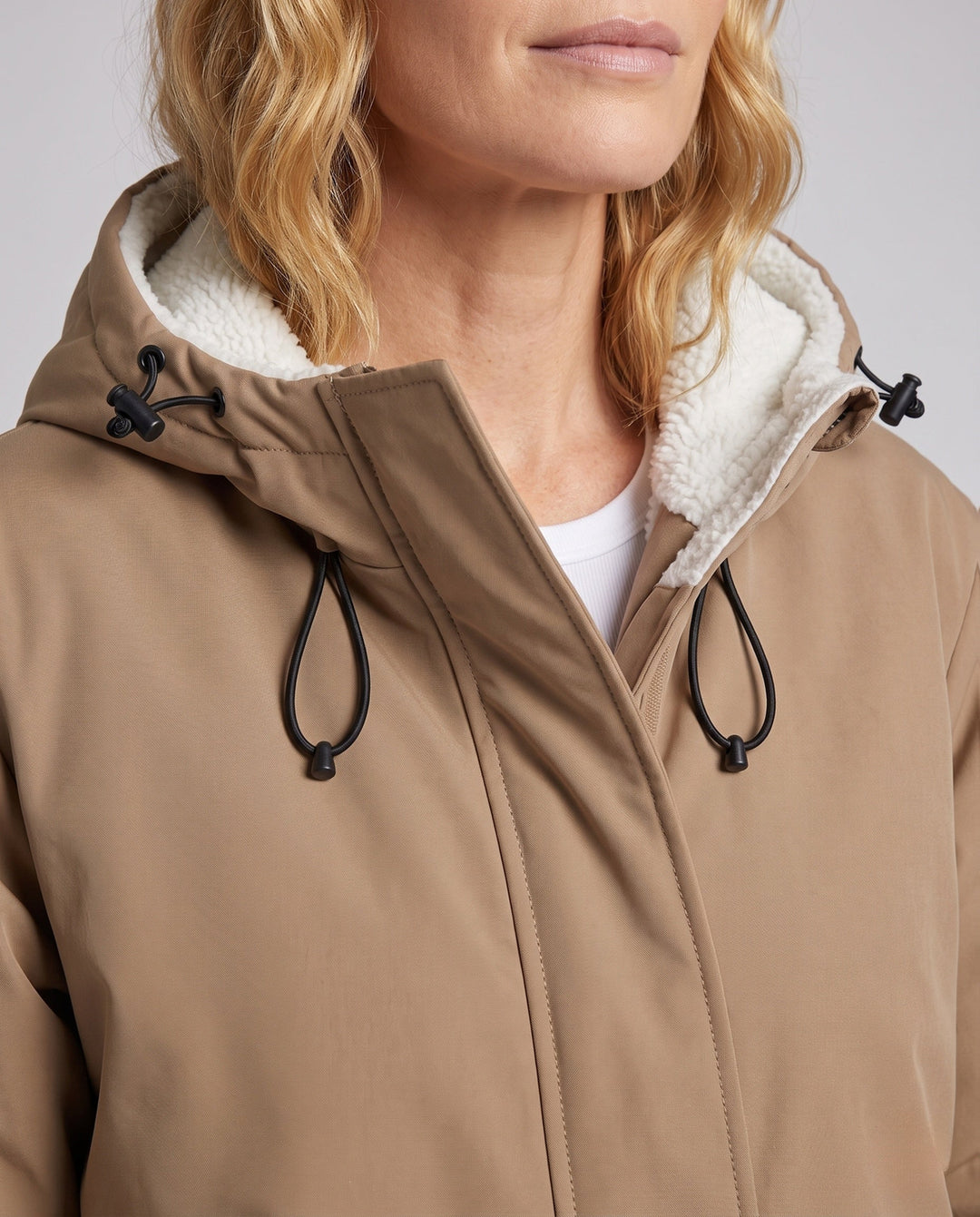 Unisex padded hoodie with teddy fleece lining, concealed front placket and adjustable hem