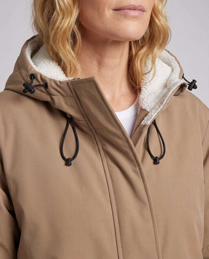 Unisex padded hoodie with teddy fleece lining, concealed front placket and adjustable hem