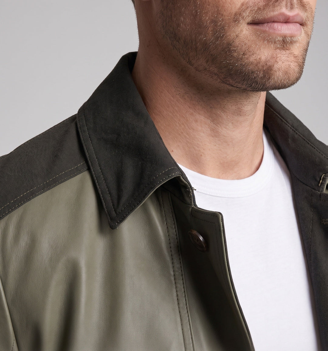 Men's field jacket with corduroy trim, zippered chest pocket, and checked lining