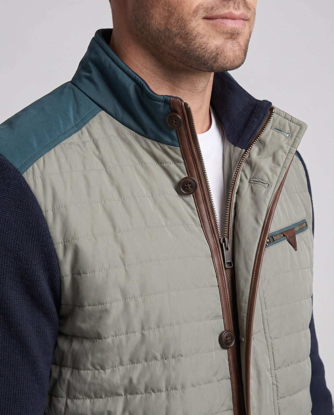Men's hybrid quilted jacket with knitted sleeves and stand-up collar