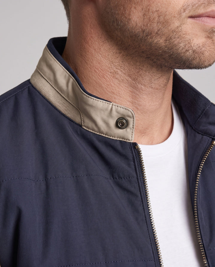 Men's lightly padded city jacket with contrast sleeves, stand-up collar, and decorative inner lining