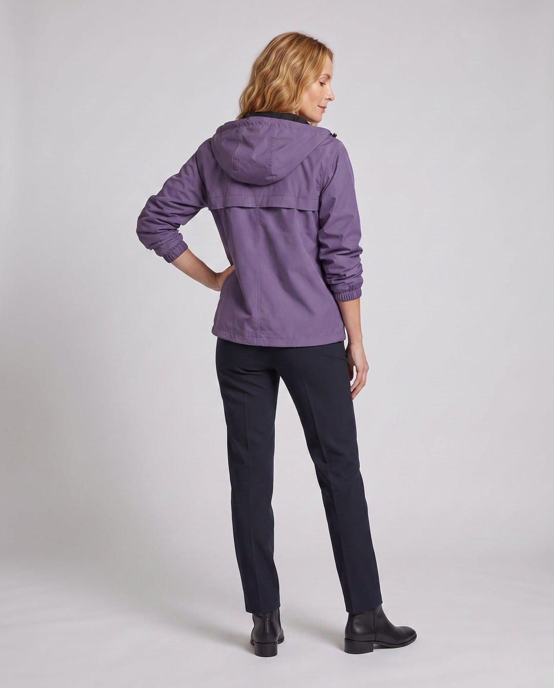 Women's transitional hooded jacket with zipper, elastic hem, and patch pockets