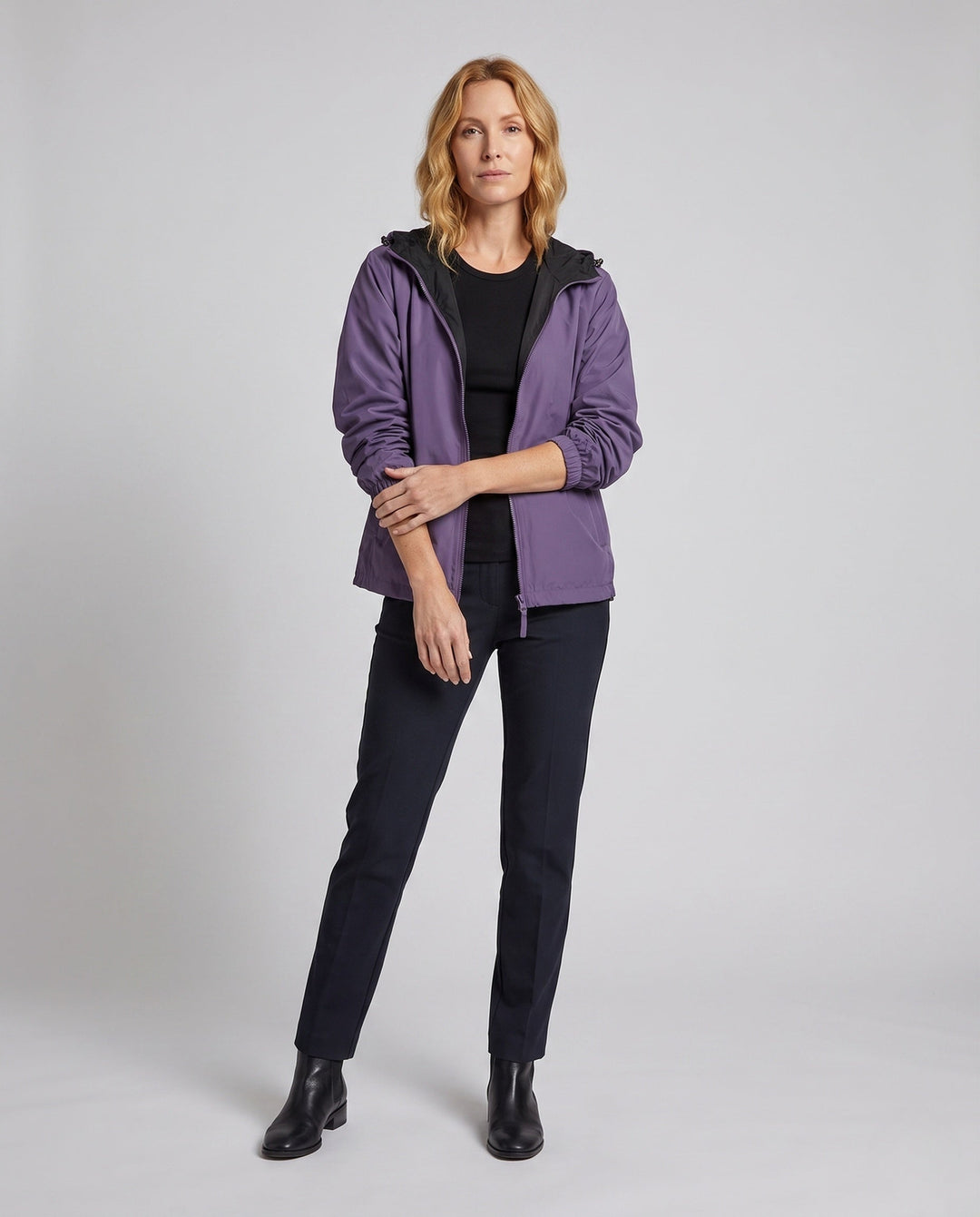 Women's transitional hooded jacket with zipper, elastic hem, and patch pockets