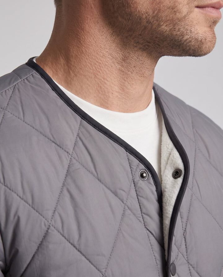 Men's quilted jacket with teddy lining and snap button closure