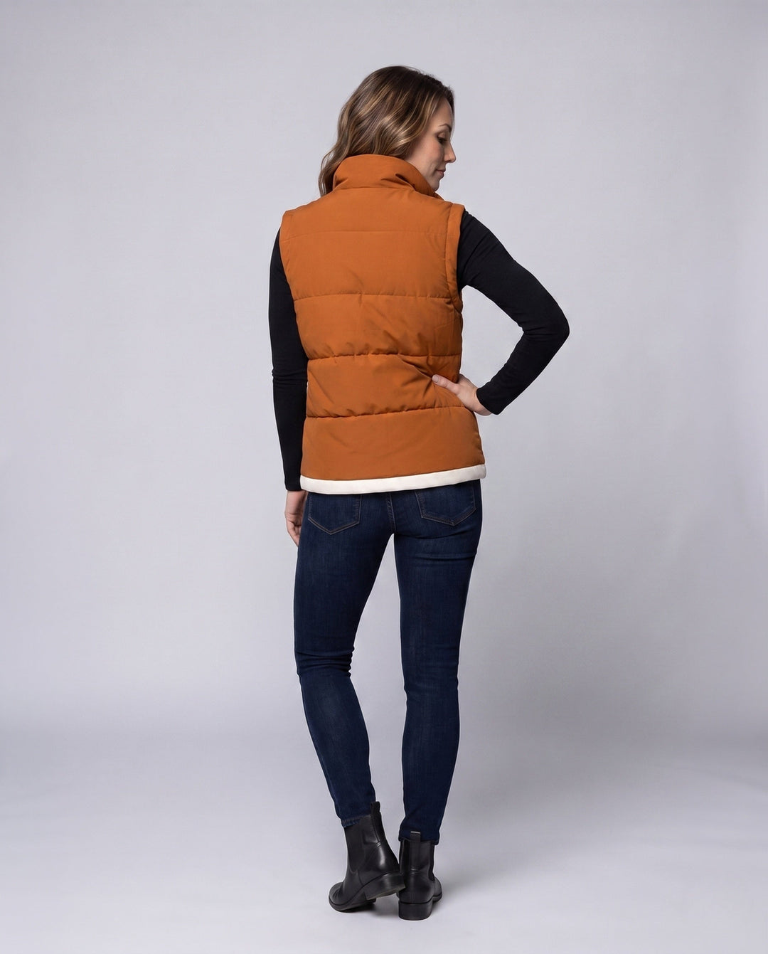 Women’s lightweight quilted hooded vest with thermal lining, wind protection, and side pockets