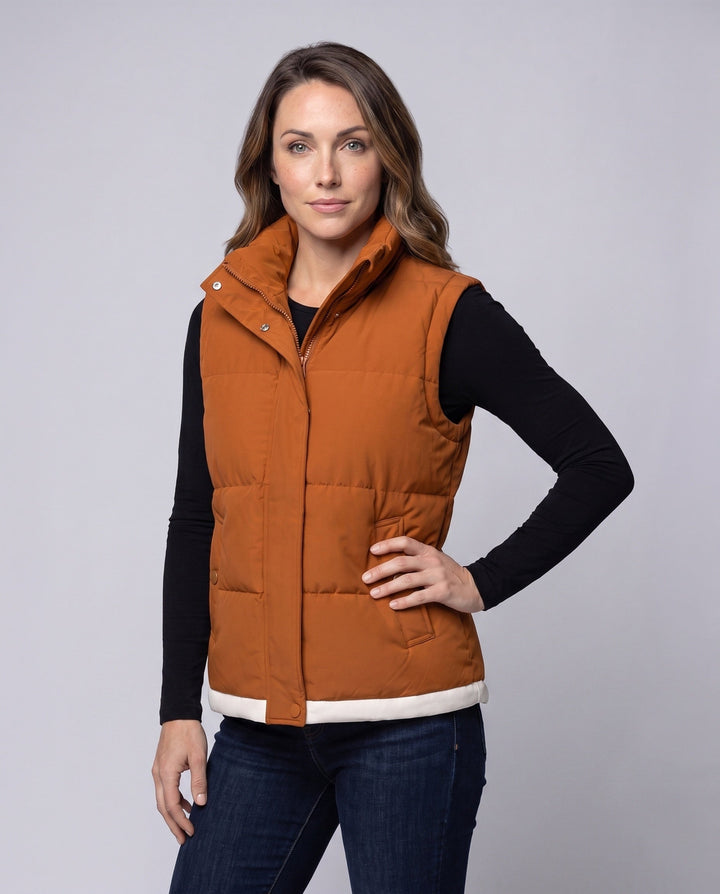 Women’s lightweight quilted hooded vest with thermal lining, wind protection, and side pockets