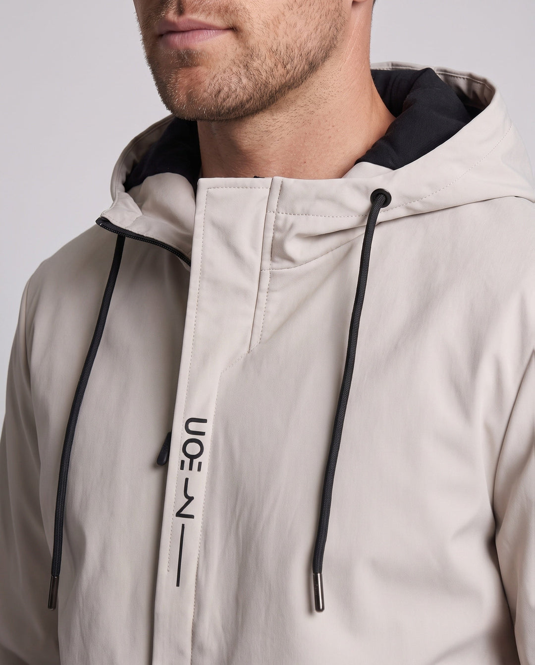 Men's modern lightweight softshell hybrid hoodie jacket with adjustable hood and waterproof zip pockets