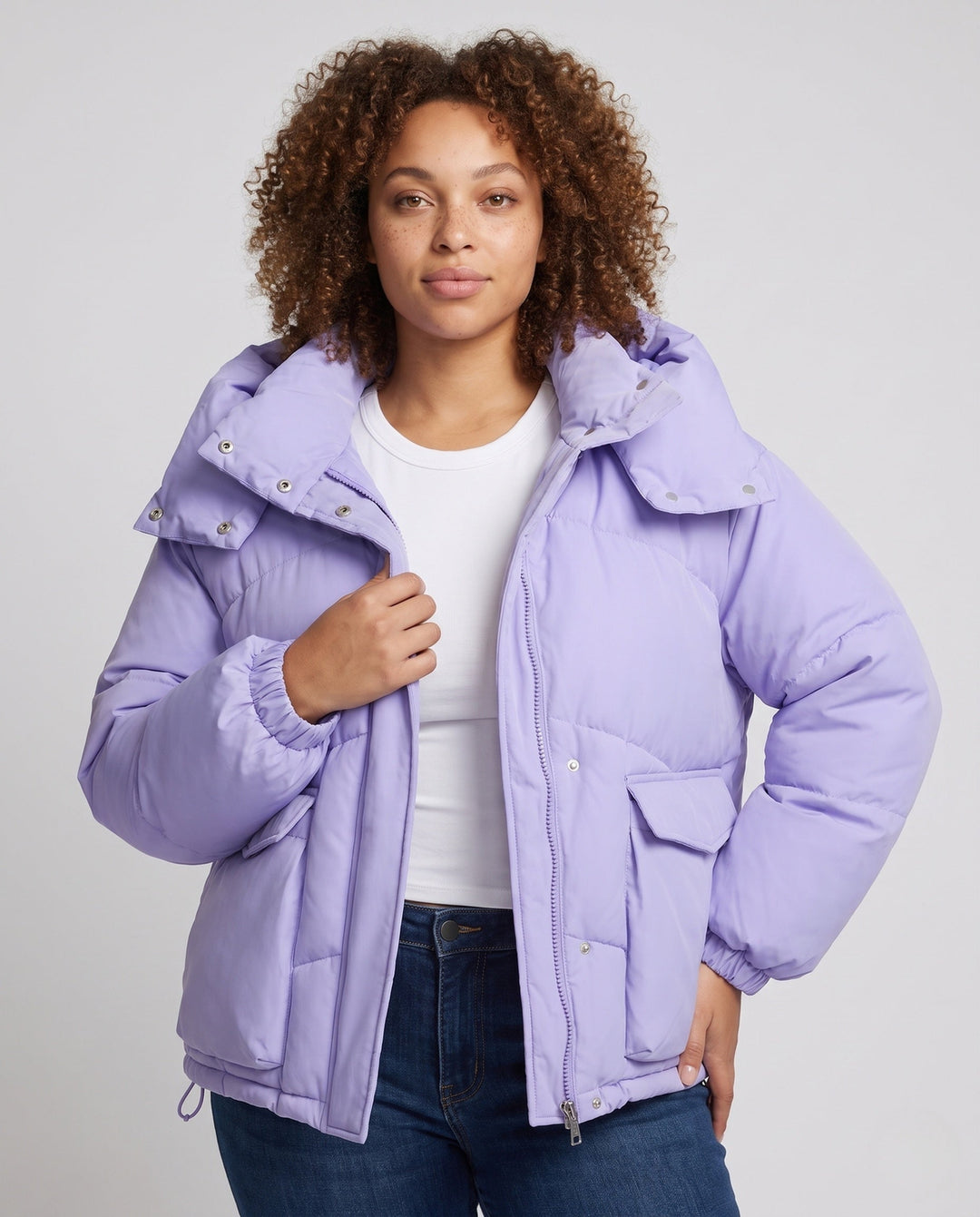 Ladies' short padded hooded puffer with oversized hood, flap pockets, and adjustable hem